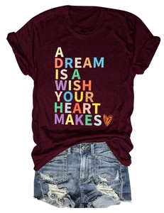 Flat lay of maroon cotton blend t-shirt with heart graphic and distressed denim shorts