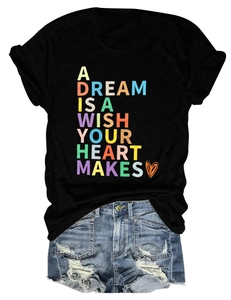 Detail showing rainbow lettering A Dream Is A Wish Your Heart Makes on black t-shirt