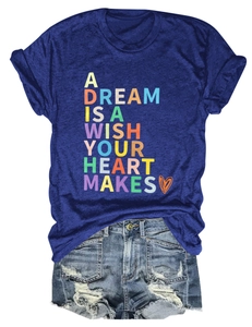 Flat lay of blue T-shirt featuring a colorful graphic print and distressed denim shorts