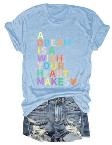 Flat lay of blue cotton t-shirt with colorful text and distressed denim shorts set