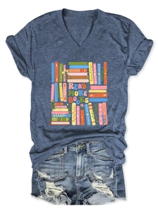 Flat lay of a denim blue V-neck T-shirt with 'Read More Books' print and ripped denim shorts