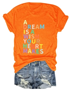 Flat lay of an orange cotton T-shirt with artistic text and distressed denim shorts set