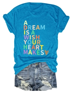Flat lay of bright blue crew neck t-shirt with colorful typography and denim shorts