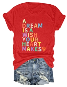Detail of red T-shirt with 'A DREAM IS A WISH' print and distressed denim shorts