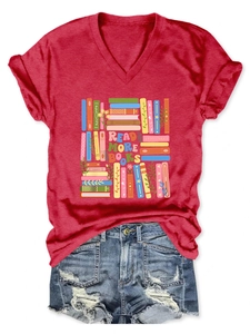 Detail of red V-neck T-shirt with 'READ MORE BOOKS' graphic and denim shorts