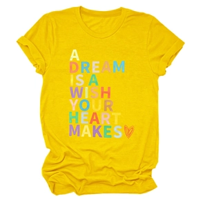 Detail of yellow cotton t-shirt with multicolored A Dream Is A Wish Your Heart Makes print