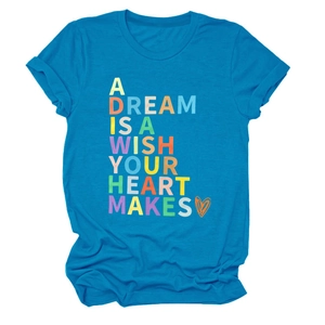 Detail of blue T-shirt featuring A Dream Is A Wish Your Heart Makes quote and orange heart