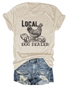 Detail of Local Egg Dealer tee with retro rooster print and distressed denim shorts