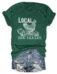 Detail of Local Egg Dealer print on dark green t-shirt with chic hand-drawn hen graphic