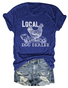 Detail view of a navy blue T-shirt with local egg dealer vintage graphic and denim shorts