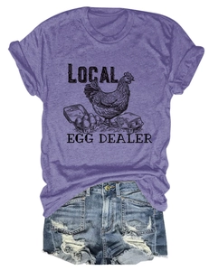Flat lay of purple cotton t-shirt with local egg dealer print and denim shorts