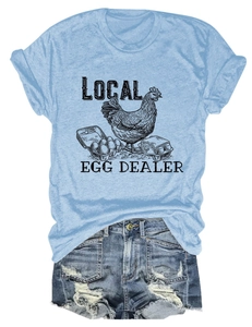 Flat lay of blue melange t-shirt with local egg dealer print and ripped denim shorts