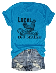 Detail of Local Egg Dealer blue t-shirt with chicken print and distressed denim shorts
