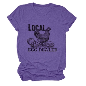 Detailed macro view of the Local Egg Dealer graphic on a heather purple cotton T-shirt