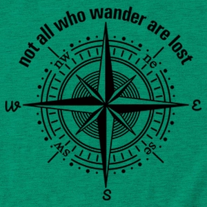 Macro detail of 'not all who wander' black compass print on green cotton T-shirt fabric