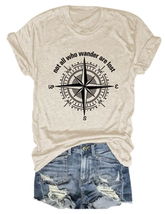 Detail of oat-colored cotton T-shirt with black compass print and outdoor wander text