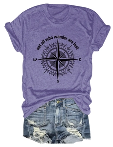 Detail of purple t-shirt with Not All Who Wander Are Lost slogan and compass print