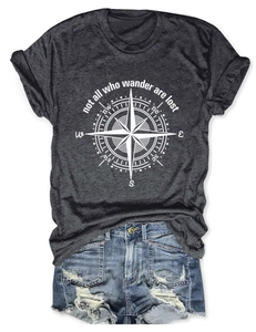 Flat lay of gray outdoor t-shirt with compass print and distressed denim shorts