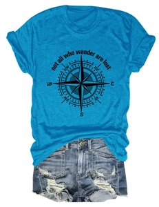 Close-up of compass print and quote on royal blue t-shirt with denim shorts set