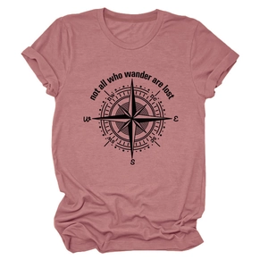 Detailed flat lay of mauve t-shirt featuring a black compass and outdoor quote print
