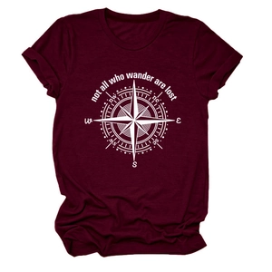 Detail of burgundy cotton T-shirt featuring white compass print and wanderlust quote