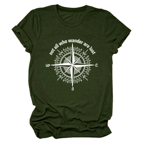 Detail of dark green t-shirt featuring a white compass print and wander slogan