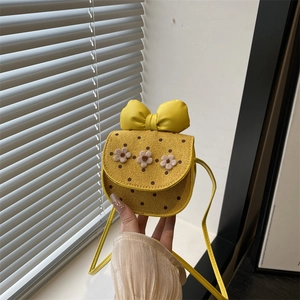 Cute yellow mini crossbody bag for girls with large bow and 3D floral accents