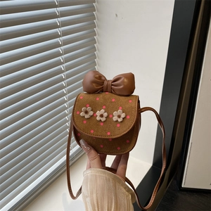 Mini brown suede crossbody bag with pink bow and 3D plush flower decorations