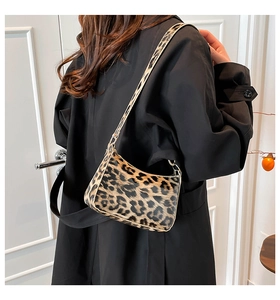 Detailed view of the leopard print shoulder bag with a stylish crescent moon design