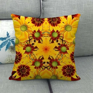 Detailed texture of bohemian square pillowcase with yellow sunflower pattern on grey sofa