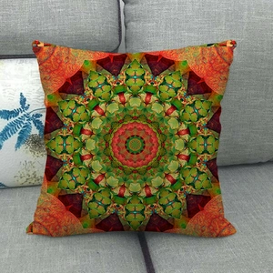 Bohemian geometric linen cushion cover with colorful mandala pattern on a sofa
