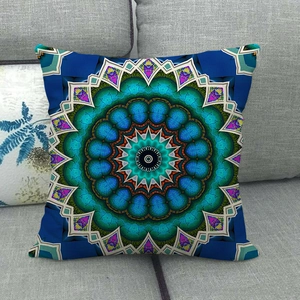 Detailed close-up of mandala geometric pattern on blue linen throw pillow cover
