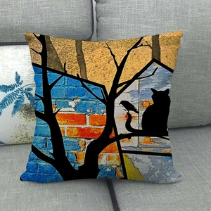 Watercolor cat on tree art linen pillowcase on grey sofa with vibrant blue orange graffiti