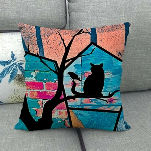 Detail of square linen pillowcase featuring a watercolor cat and bird silhouette on a sofa