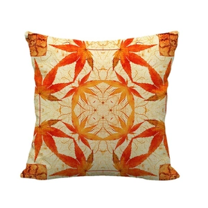 Bohemian linen pillow cover featuring symmetrical orange maple leaf geometric patterns