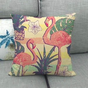 Detail of linen pillow cover with flamingo, pineapple, and tropical leaf texture