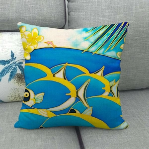 Detailed texture of linen cushion cover featuring vibrant tropical fish and dolphin prints