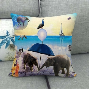 Linen pillowcase featuring creative elephant and sea wildlife print on a grey sofa