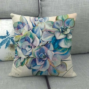 Housse de coussin en lin avec illustration aquarelle de succulentes sur canapé gris
