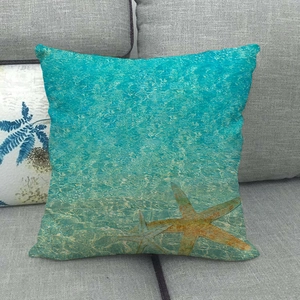Detailed texture of linen pillowcase featuring starfish and blue ocean wave patterns