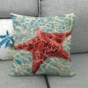Detailed fabric texture of linen pillowcase with artistic red starfish and blue wave pattern