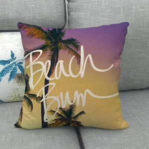 Linen pillow cover with tropical sunset palm tree print and Beach Bum artistic text