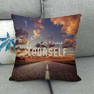 Tropical sunset beach landscape pillowcase with Express Yourself text on gray sofa