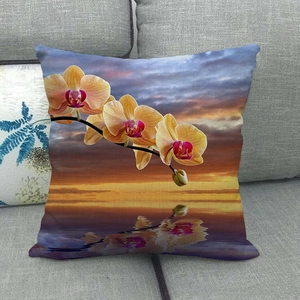 Linen pillow cover featuring sunset water landscape and yellow orchid floral print