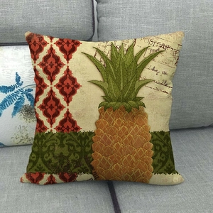 Detail of vintage linen pillowcase with pineapple motifs and retro postcard elements