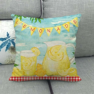 Detailed macro of a linen pillow case with watercolor lemonade print on a gray sofa