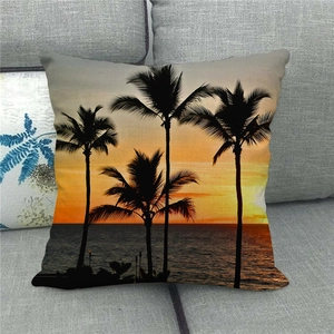 Detail of tropical sunset watercolor palm tree print on linen throw pillow case
