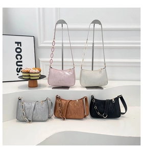 Detail of diverse colors and pleated texture on minimalist corduroy shoulder bags