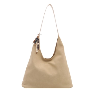 Minimalist camel suede tote bag with colorful wooden bead charm on a white background