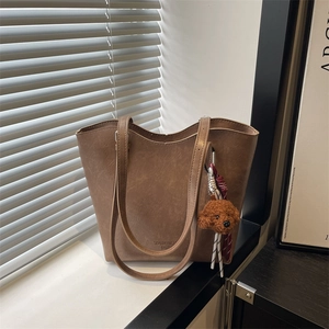 Brown vintage faux leather tote bag with teddy charm and TidalDryness logo